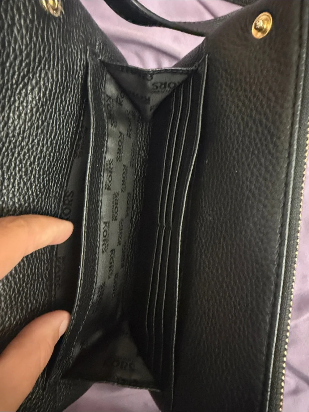 Michael Kors Black Pebbled Leather Crossbody with Gold MK Emblem.